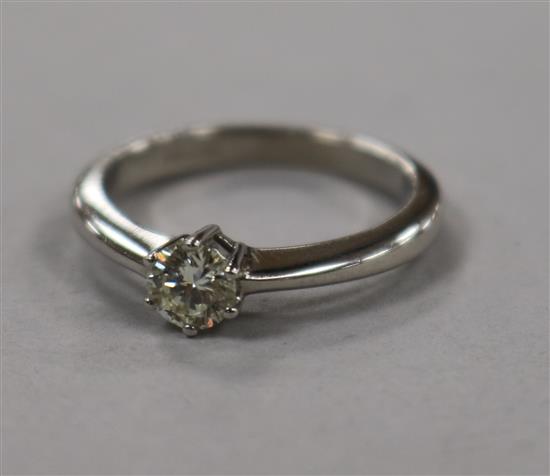 An 18ct white gold and solitaire diamond ring, size L.